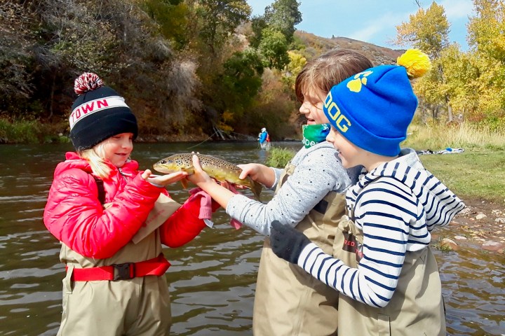 children holding a fish