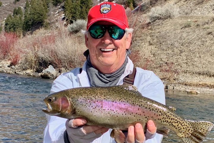 a man holding a fish