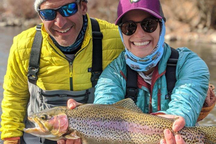 a person holding a fish