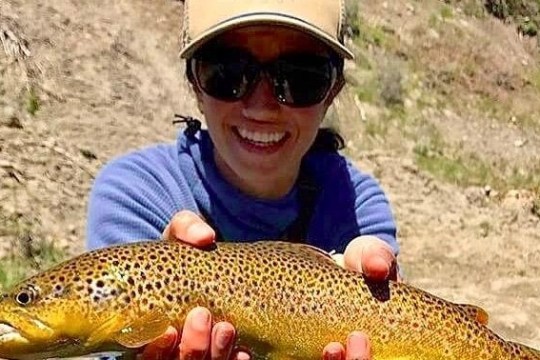 a person holding a fish