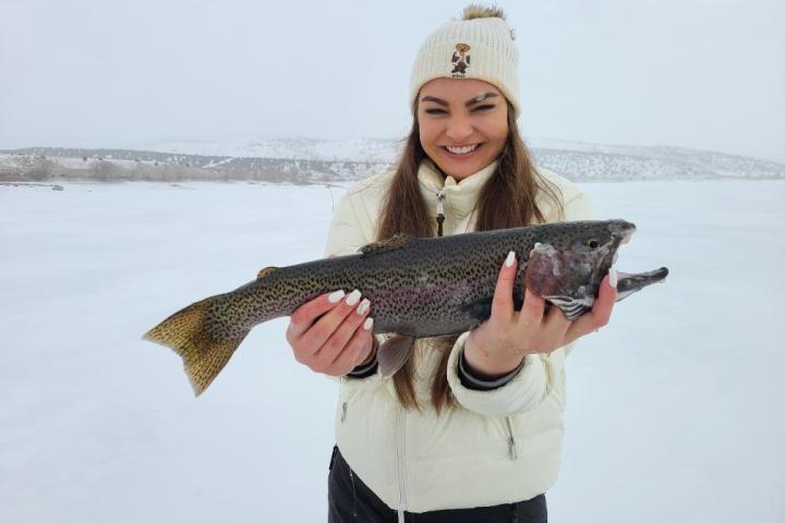 a person holding a fish