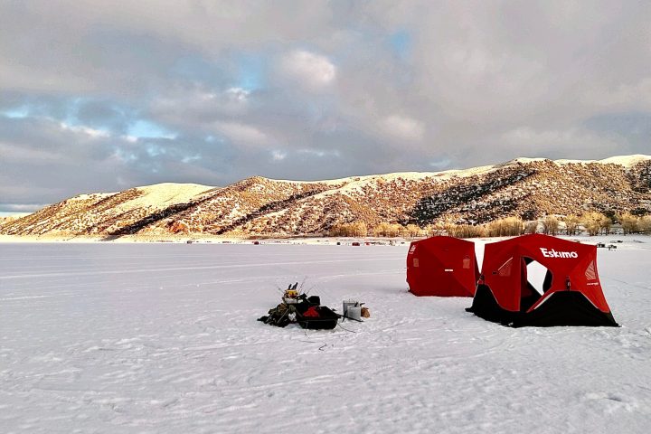 a group of people riding skis on top of a snow covered slope
