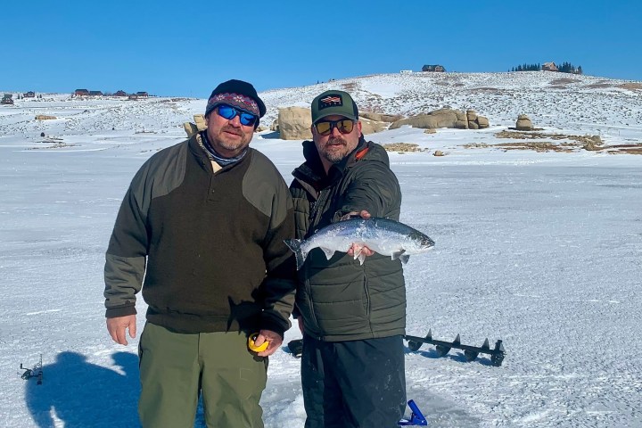 a man that is standing in the snow