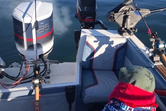 a boat sitting on top of a car